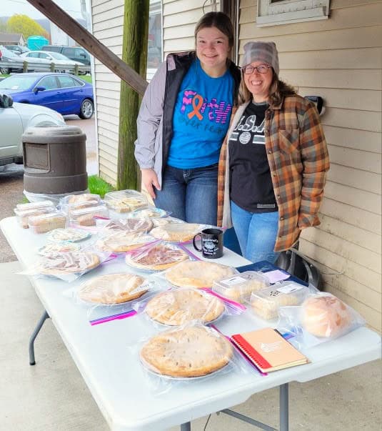 Chaseburg Area Cancer Walk volunteers selling their baked goods