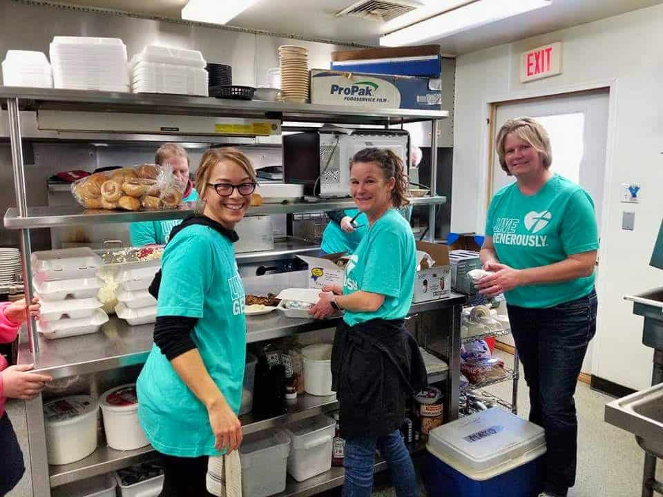 Chaseburg Area Cancer Walk volunteers packaging meals