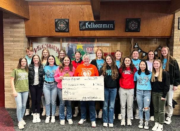 Chaseburg Area Cancer Walk volunteers holding a large check