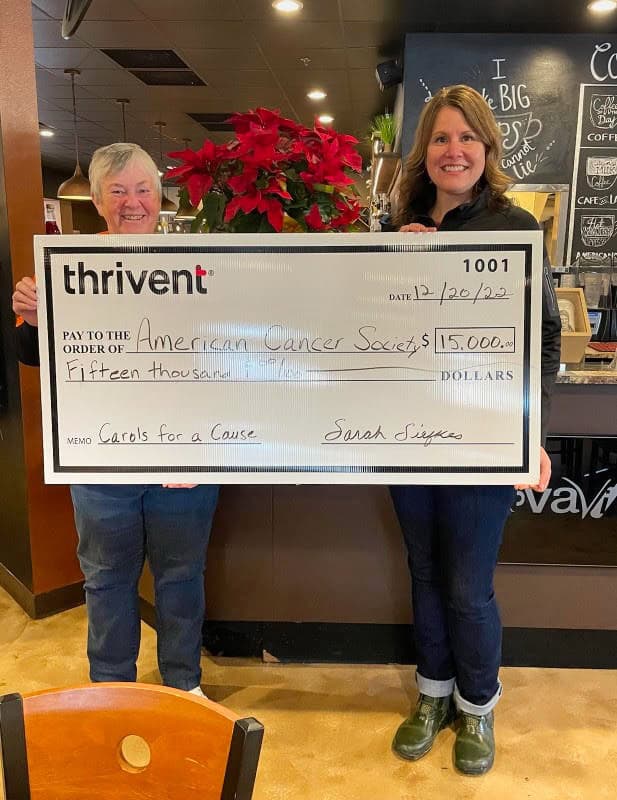 Chaseburg Area Cancer Walk volunteers holding a check for $15000 from Thrivent