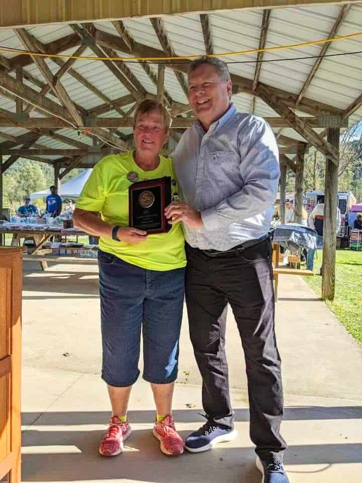 Chaseburg Area Cancer Walk volunteers holding a plaque